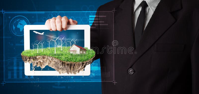 Homem de negócios que apresenta uma terra perfeita da ecologia com uma casa e um w imagem de stock Homem de negócios que apresenta uma terra perfeita da ecologia com uma casa e um w imagem de stock
