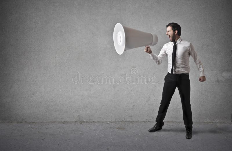 Homem De Negócios Que Guarda Um Megafone Enorme Imagem De Stock