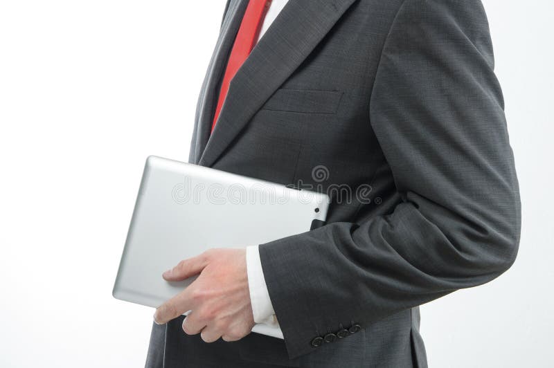 Homem de negócios que leva a tabuleta digital fotos de stock royalty free Homem de negócios que leva a tabuleta digital fotos de stock royalty free