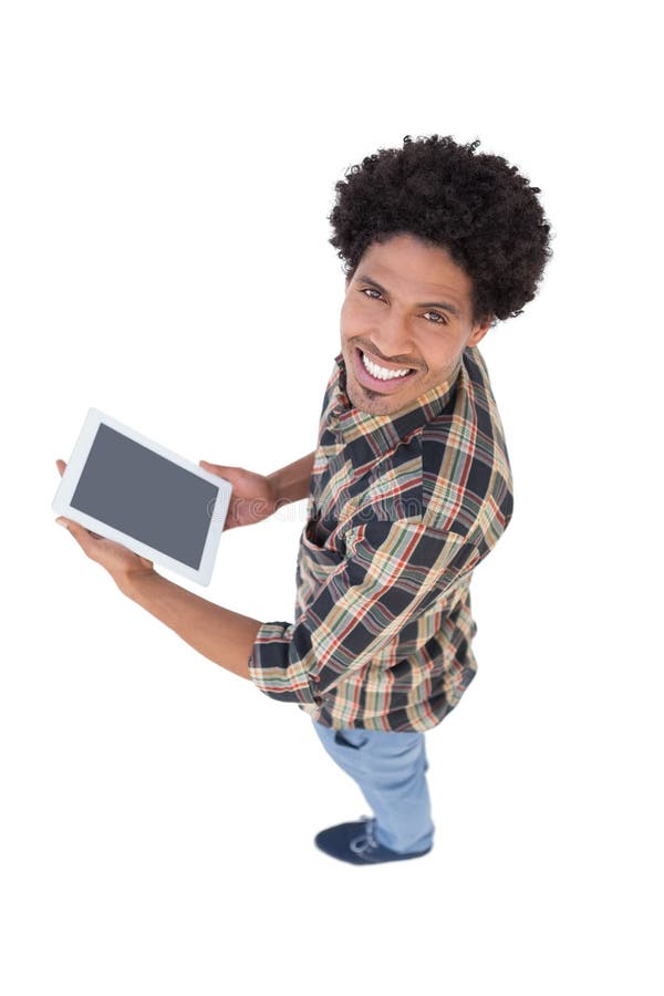 Homem feliz que guarda a tabuleta de Digitas foto de stock royalty free Homem feliz que guarda a tabuleta de Digitas foto de stock royalty free