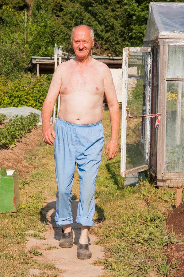 Elderly man on a suburban area in a sunny day. Elderly man on a suburban area in a sunny day