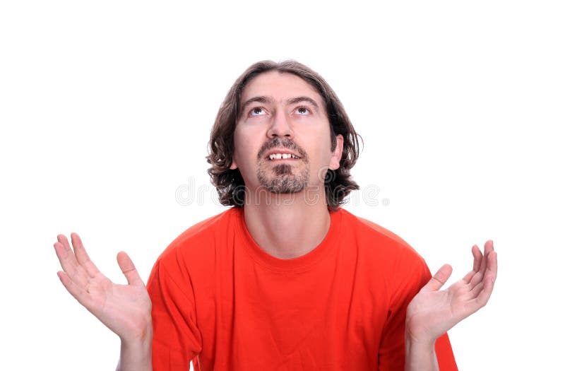 Homem novo ocasional que praying imagens de stock royalty free Homem novo ocasional que praying imagens de stock royalty free