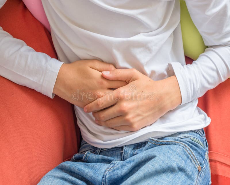Young man suffering from stomach ache, diarrhea, constipation, acid reflux, indigestion or nausea. Young man suffering from stomach ache, diarrhea, constipation, acid reflux, indigestion or nausea