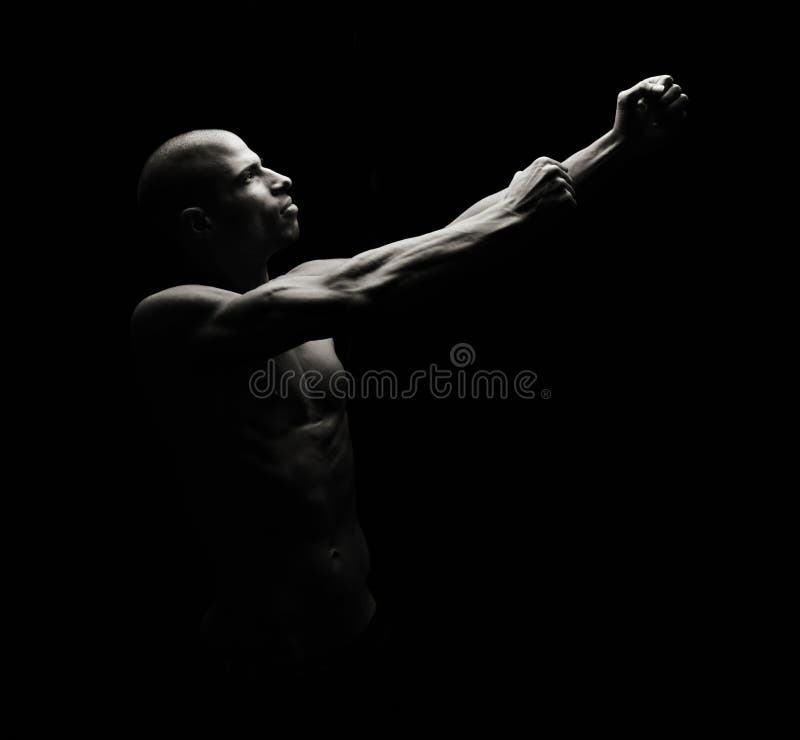 Artistic Fitness on a black background, Low key. Artistic Fitness on a black background, Low key