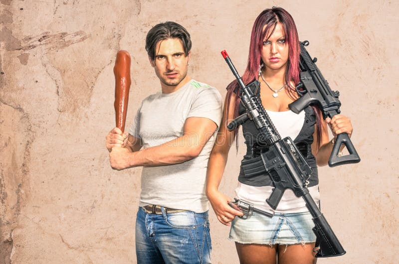 Primitive men and modern women with weapons. Primitive men and modern women with weapons