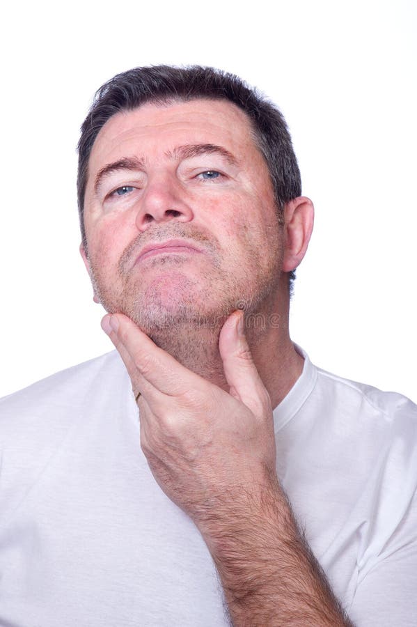 Homem que põr olhando a barba imagem de stock royalty free Homem que põr olhando a barba imagem de stock royalty free