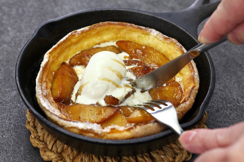 Homemade apple dutch baby pancake with ice cream