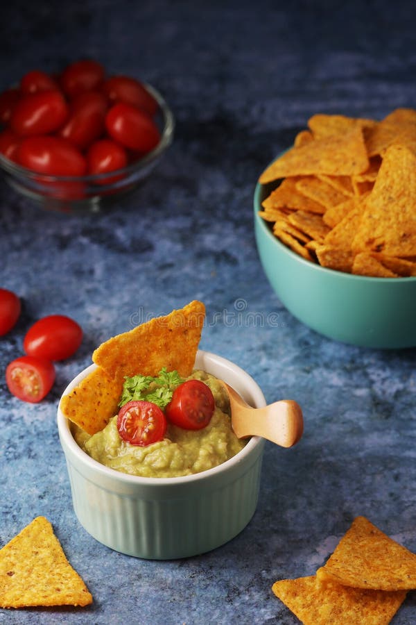 Homemade Guacamole with Corn Chips and Cherry Tomatoes Stock Image