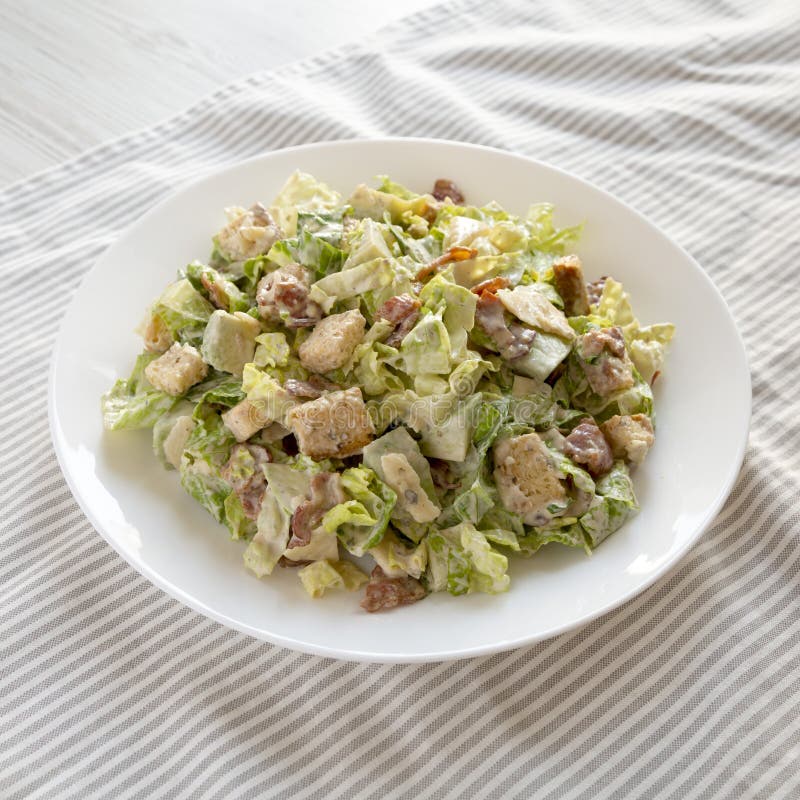 Homemade Bacon Avocado Caesar Salad with Cheese and Croutons, Low Angle