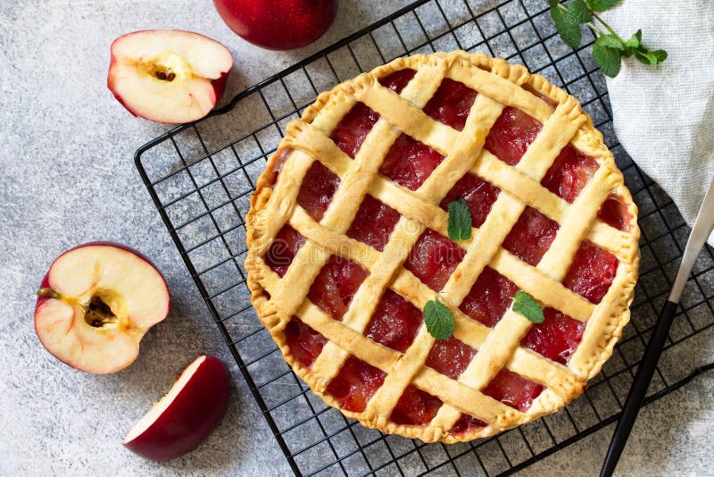 Homemade baking. Autumn apple pie on a light stone or slate table. stock photography