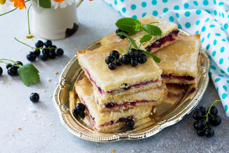 Homemade baking. Cookies with black currant jam on a gray stone or slate background royalty free stock image