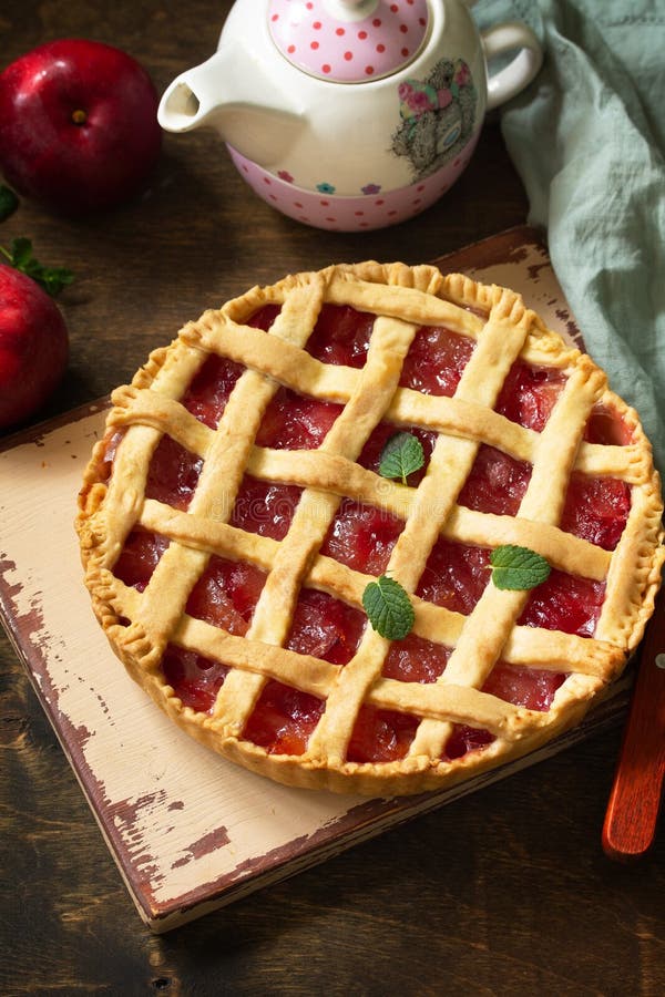 Homemade baking. Sweet apple pie on a rustic wooden table. royalty free stock photo