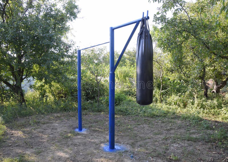 Homemade Bar with a Punching Bag Outdoors in the Garden. Stock Photo