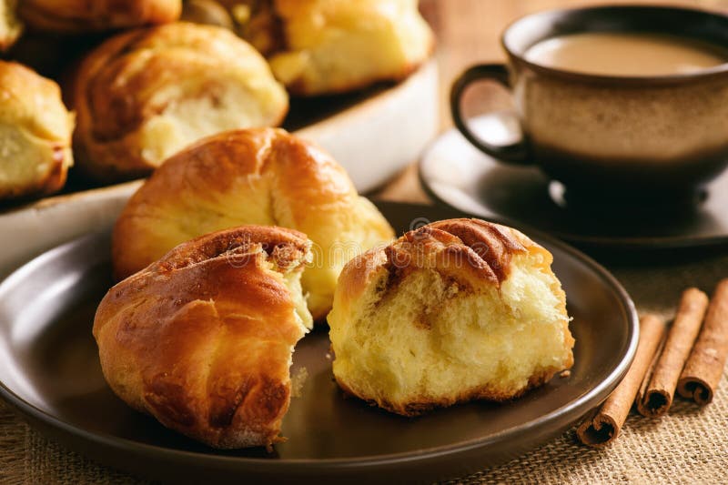 Homemade Bread Buns with Cinnamon and Cup of Coffee. Stock Image