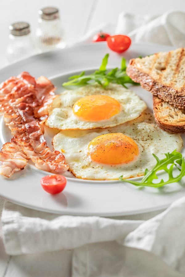 Homemade Breakfast with Toast, Bacon, Eggs and Tomatoes Stock Photo ...