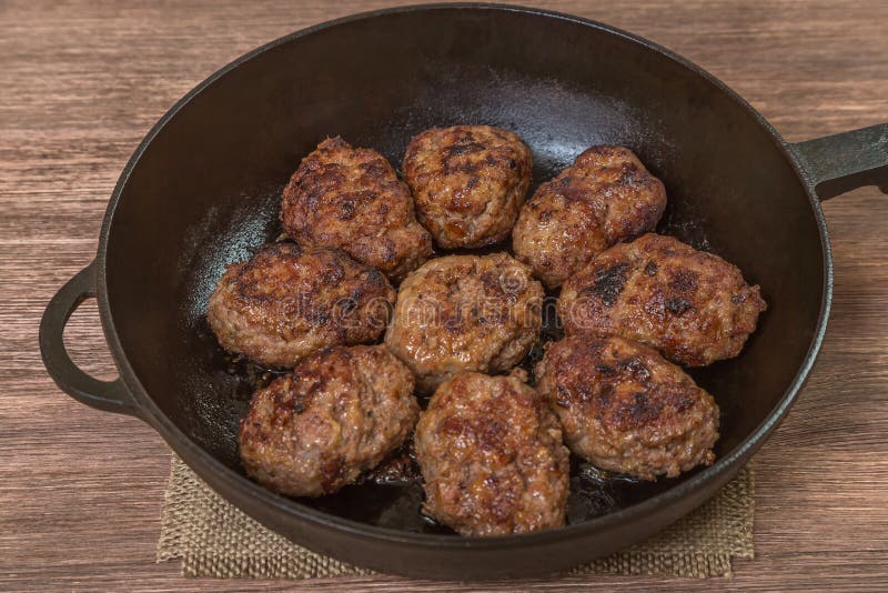 Homemade Burgers in a Frying Pan. the View from the Top. Space To
