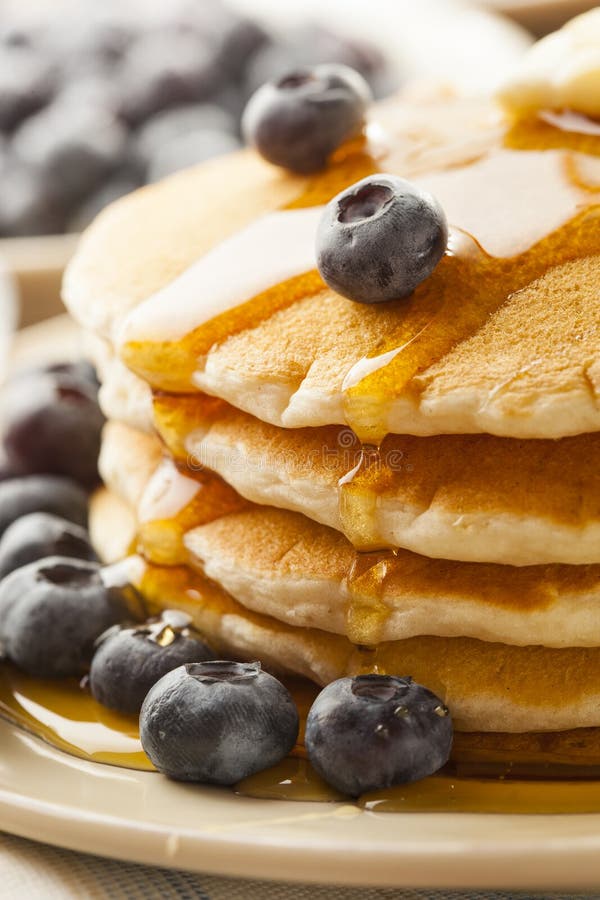 Homemade Buttermilk Pancakes with Blueberries and Syrup Stock Photo