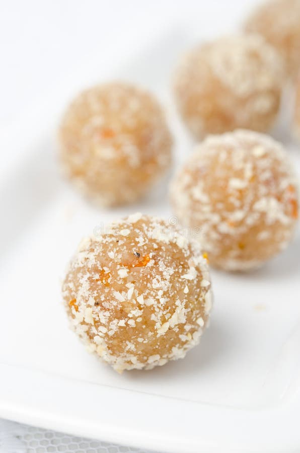 Homemade candy made of almonds, ginger and dates