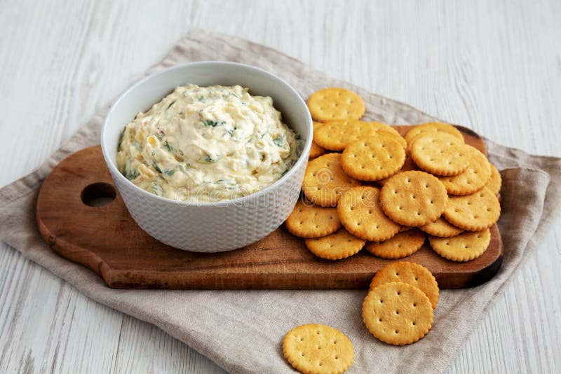 Homemade Caramelized Onion and Spinach Dip with Salty Round Crackers