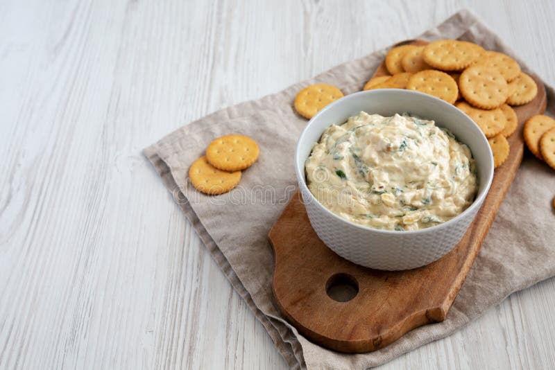 Homemade Caramelized Onion and Spinach Dip with Salty Round Crackers