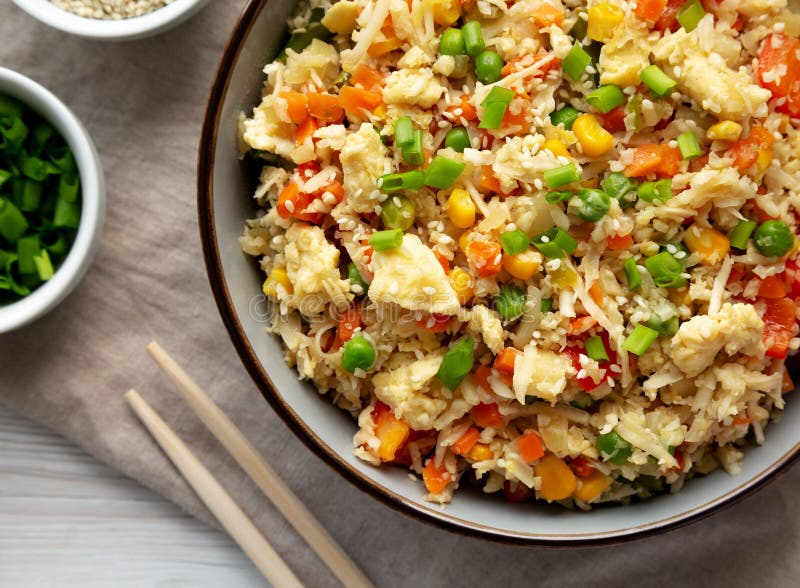 Homemade Cauliflower Fried Rice with Chives and Sesame Seeds in a Bowl ...