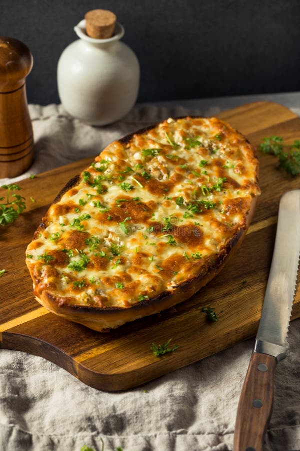 Homemade Cheesy Bread on a French Loaf royalty free stock photos