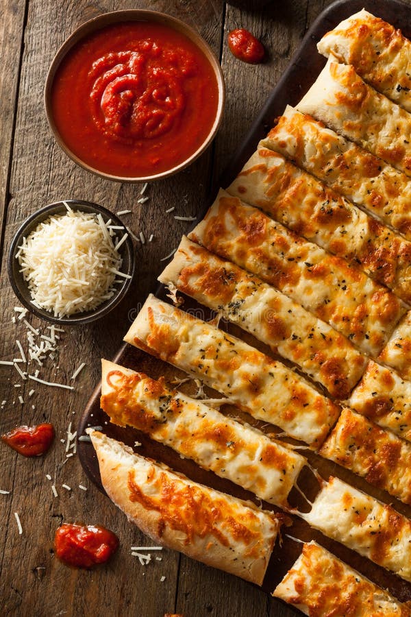 Homemade Cheesy Breadsticks with Marinara stock image