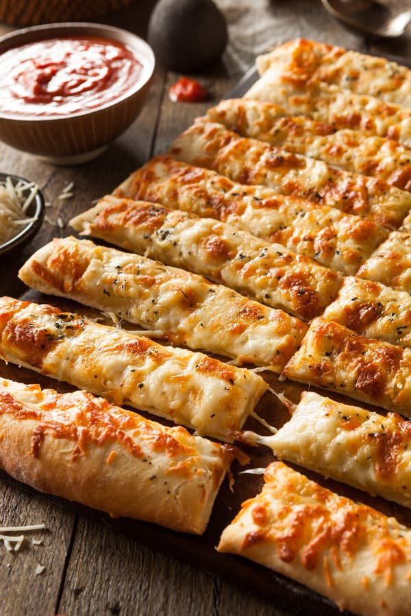 Homemade Cheesy Breadsticks with Marinara Stock Photo Image of
