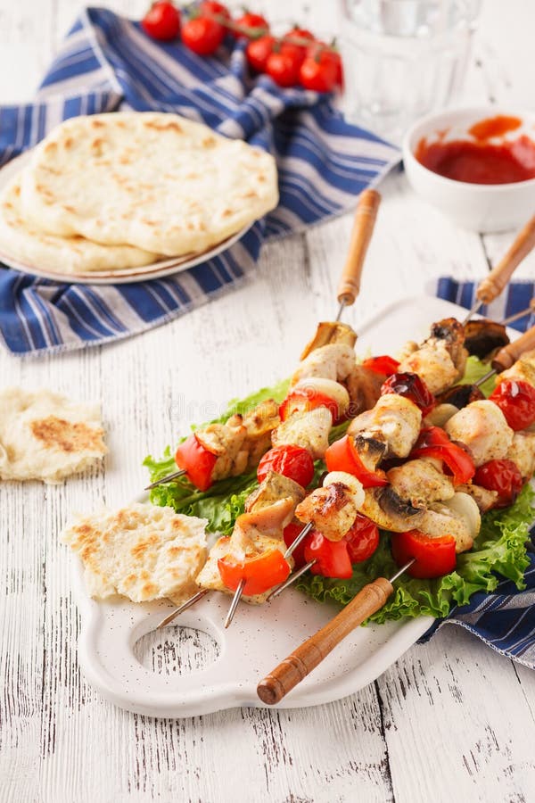 Homemade chicken shish kebab with mushrooms and bell peppers stock photo Homemade chicken shish kebab with mushrooms and bell peppers stock photo