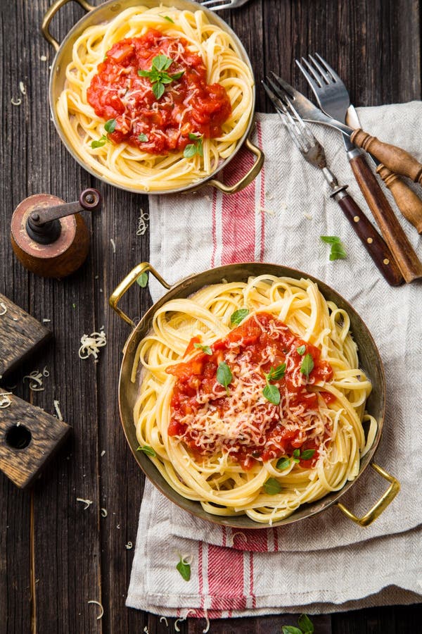 Italian pasta with tomato sauce, grated cheese, basil leaves royalty free stock image Italian pasta with tomato sauce, grated cheese, basil leaves royalty free stock image
