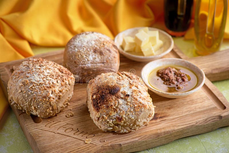 Homemade Cottage Cheese Bread Rolls in a Basket on Light Table. Stock