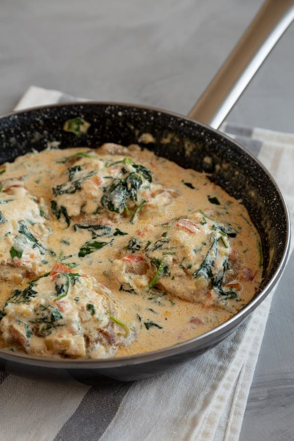 Homemade Creamy Tuscan Chicken with Spinach in a Pan, Side View Stock