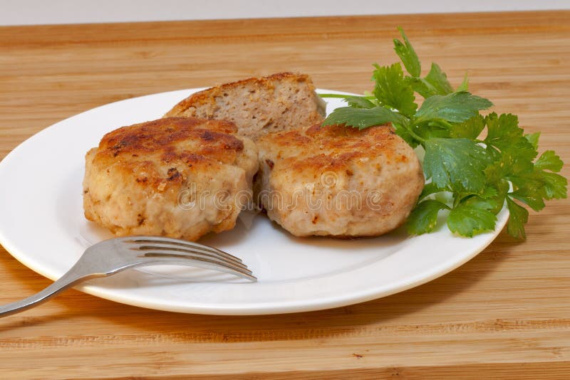 Homemade cutlets and fresh parsley