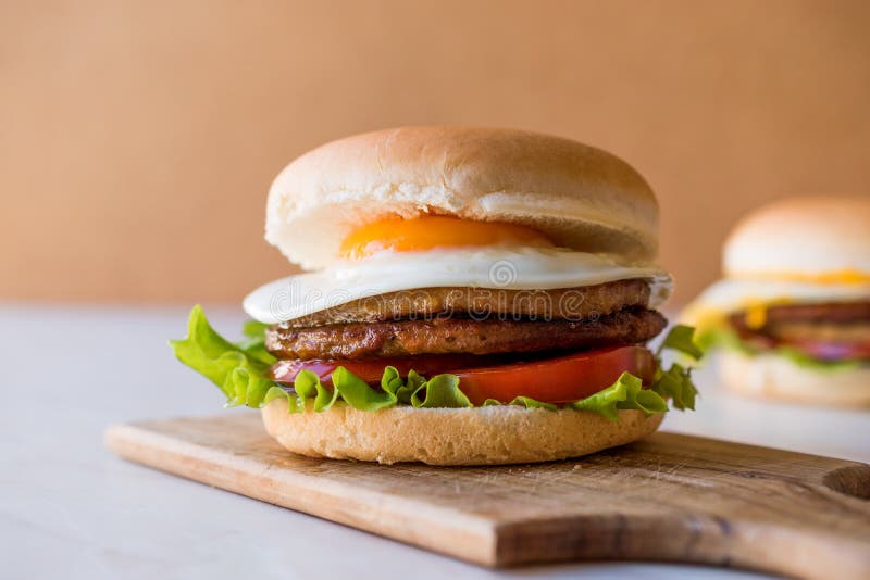 Homemade Double Hamburger With Egg, Lettuce And Tomatoes. Stock Photo ...