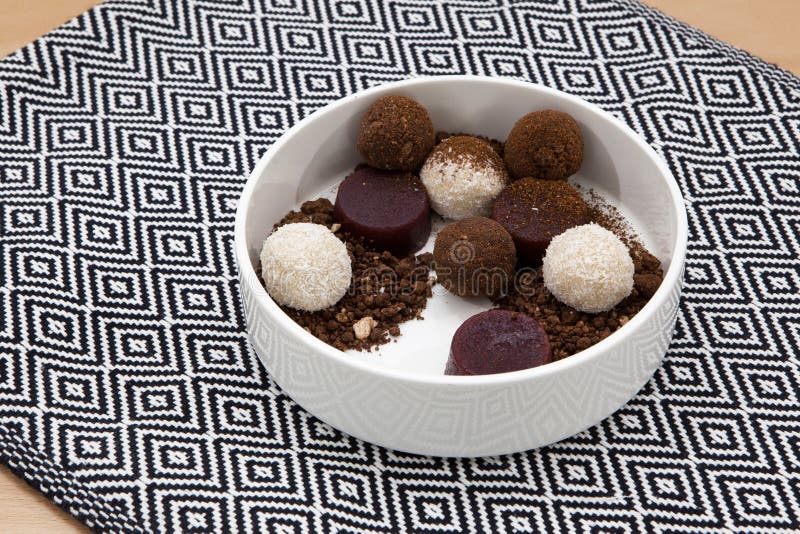 Homemade energy balls with cocoa and coconut, chocolate truffles and fresh berry marmalade. Healthy food for children and vegan, royalty free stock image Homemade energy balls with cocoa and coconut, chocolate truffles and fresh berry marmalade. Healthy food for children and vegan, royalty free stock image