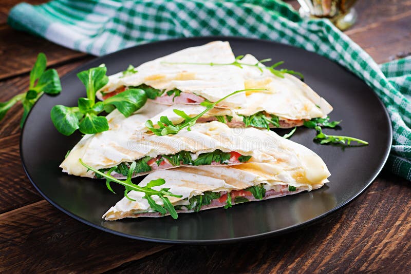 Homemade Flatbread with Ham Cheese and Tomatoes and Green Herbs Stock