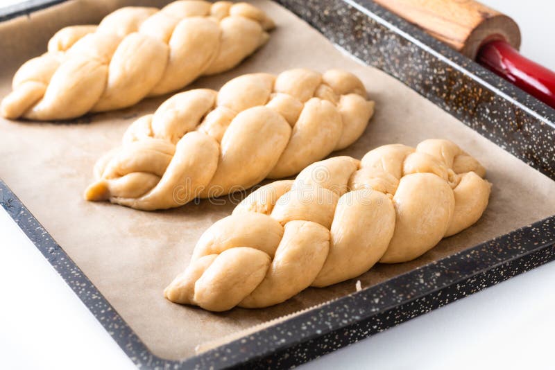 Homemade food concept process proved bread braid challah dough on white background with copy space royalty free stock images Homemade food concept process proved bread braid challah dough on white background with copy space royalty free stock images