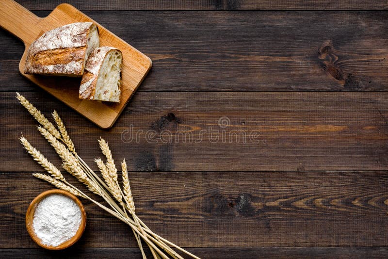 Homemade Fresh Bread Sliced On Cutting Board On Dark Wooden Background Homemade Fresh Bread Sliced On Cutting Board On Dark Wooden Background