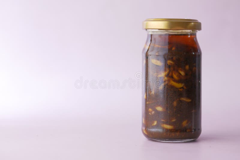 Homemade Garlic Pickle in a Glass Jar on Table , Stock Photo Image of