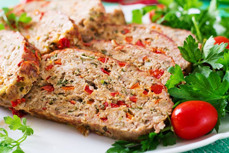 Homemade ground beef meatloaf with ketchup and bell peppers. royalty free stock images Homemade ground beef meatloaf with ketchup and bell peppers. royalty free stock images