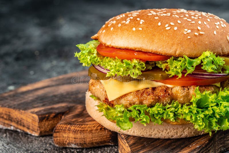 Homemade Hamburger with Beef, Tomato, Cheese, and Lettuce Stock Photo