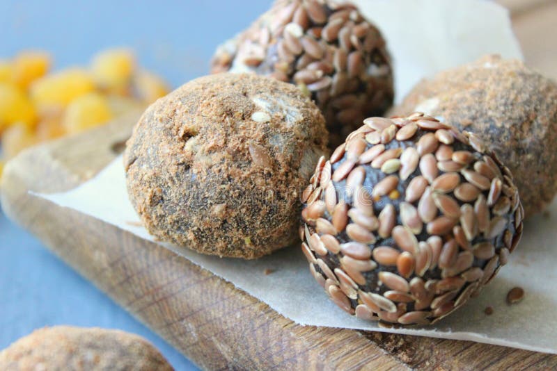 Homemade healthy raw vegan sweet balls with nuts,raisins, dates, cocoa and flax seeds. Healthy vegan food concept