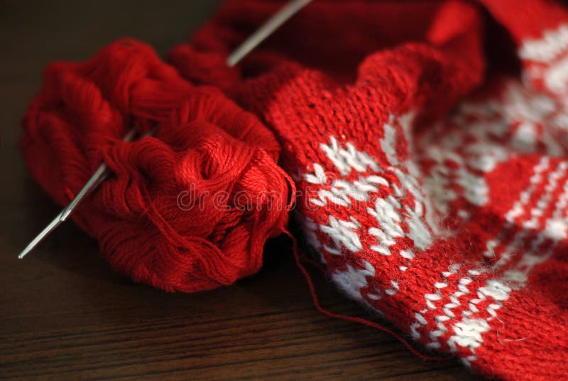Homemade Knitting from Red and White Wool with Knitting Needles. Closeup Stock Photo Image of