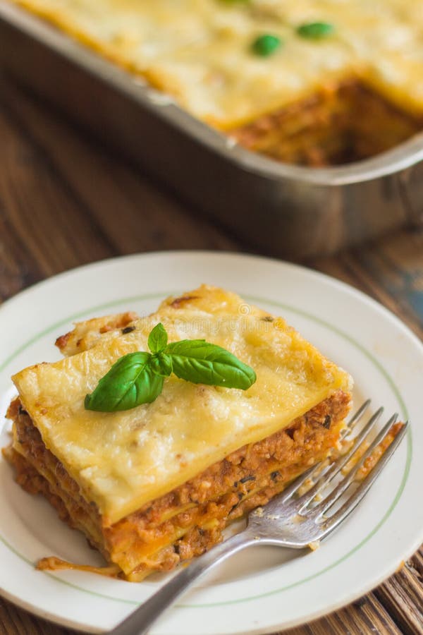 Homemade Lasagna Ready To Eat in Metal Baking Tray Served with Basil ...