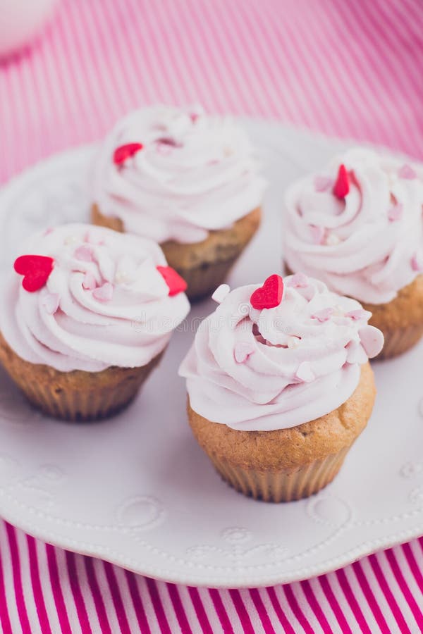 Muffins With Pink Icing And Colorful Sprinkles Stock Photo - Image of ...