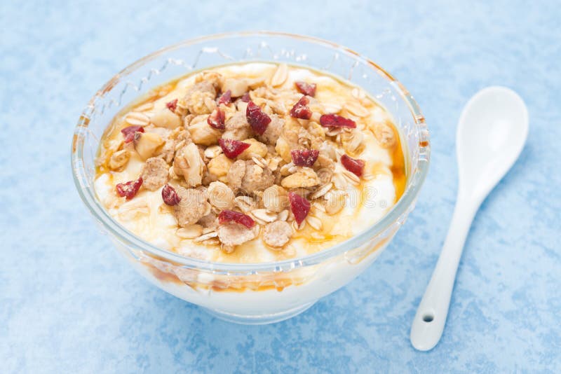 Homemade natural yogurt with maple syrup, granola