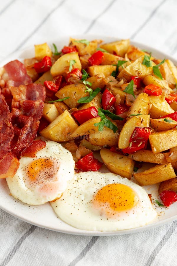 Homemade OnePan Breakfast Potatoes on a Plate, Side View Stock Photo