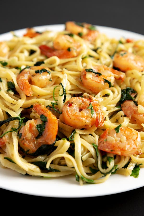 Homemade One-Pot Lemon Garlic Shrimp Pasta on a Plate on a Black
