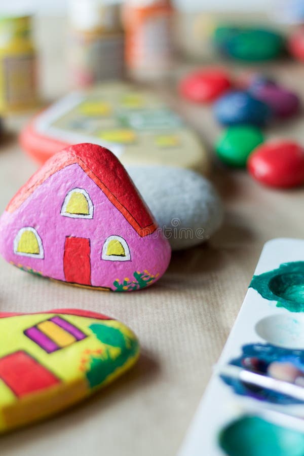 Homemade painted stone as a pink home royalty free stock image