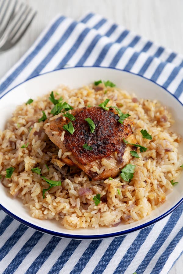 Homemade Paprika Chicken and Rice on a Plate, Side View Stock Photo